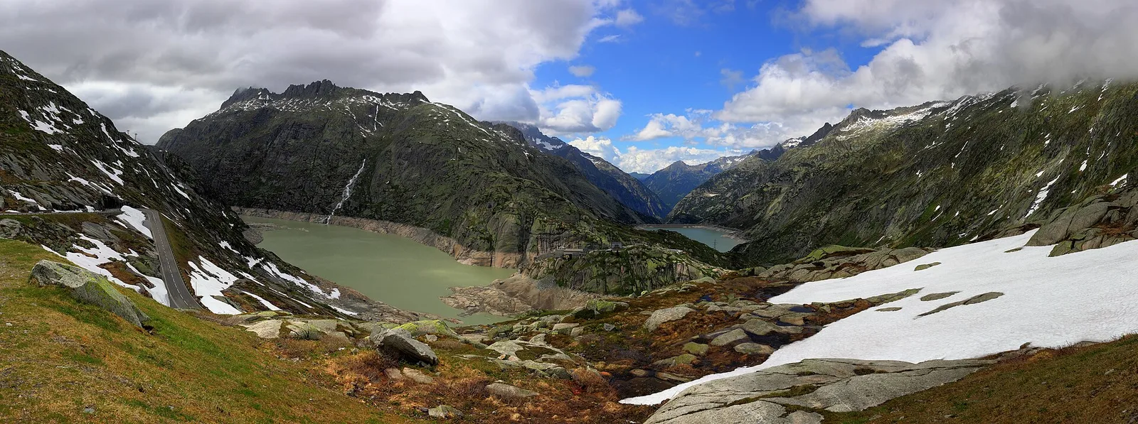 Grimsel’s reservoirs like dark glass between the granite